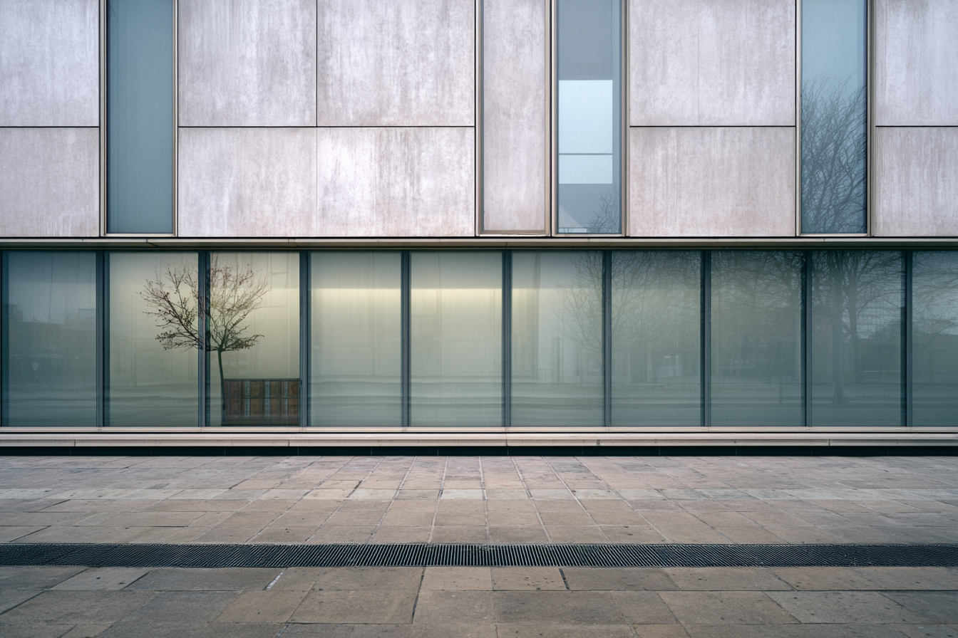 Photoreal modernist façade with plaster walls and glass panels under soft overcast light, showing balanced geometric rhythm and minimalist architectural clarity.
